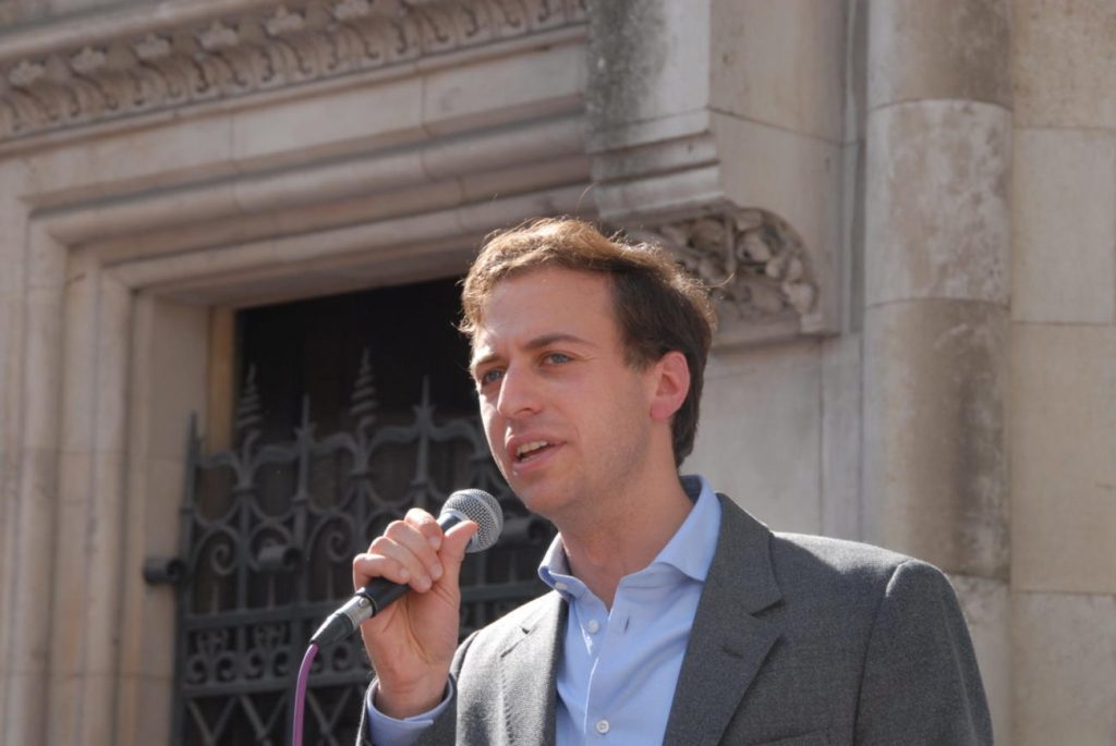 A photo of Gideon Falter, chief executive of Campaign Against Antisemitism, giving a speech