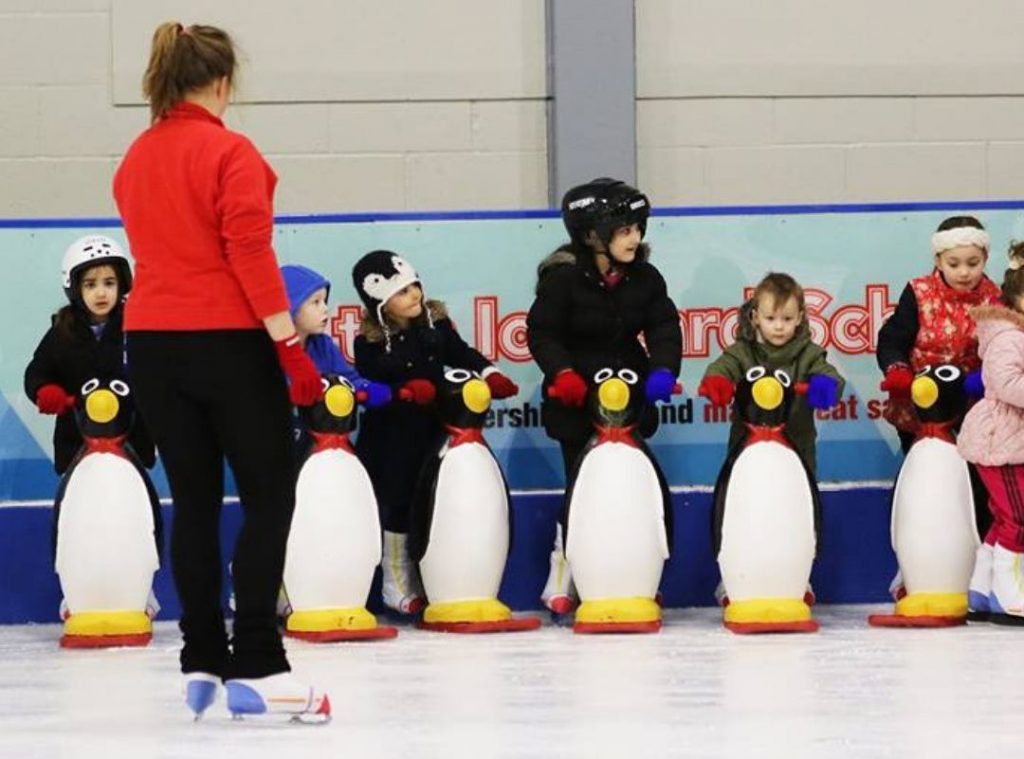 Children learn to ice skate at Manchester half term penguin holiday club